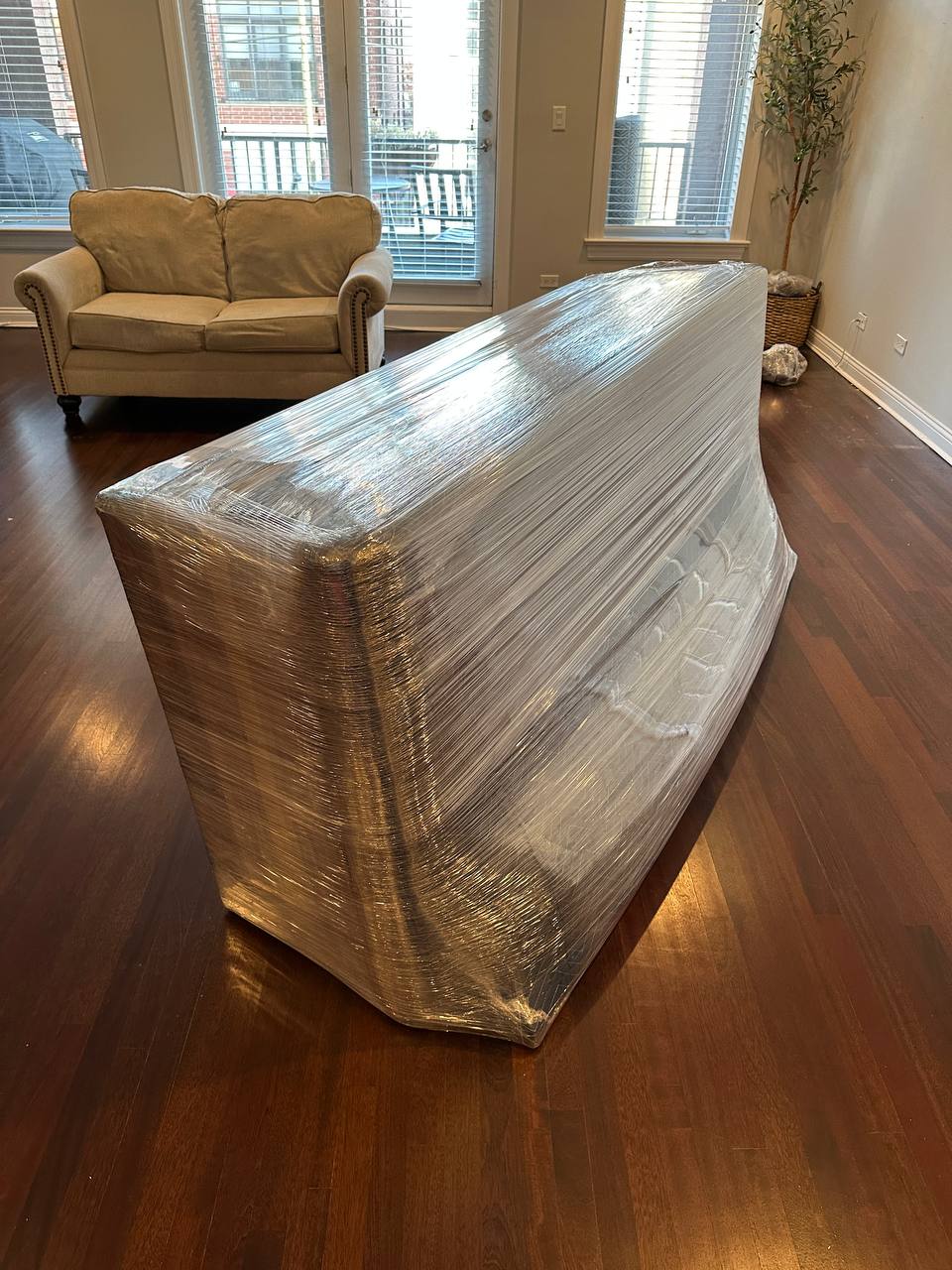 Wrapped sofa in apartment