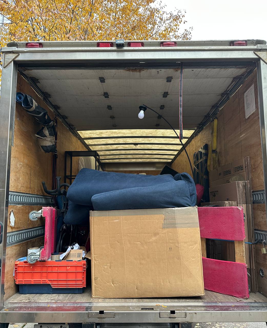 Moving truck with fall foliage background