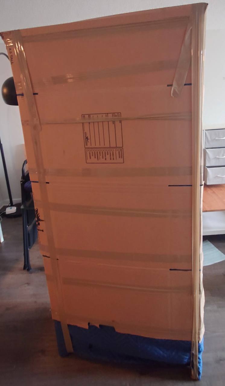 Large furniture wrapped in cardboard