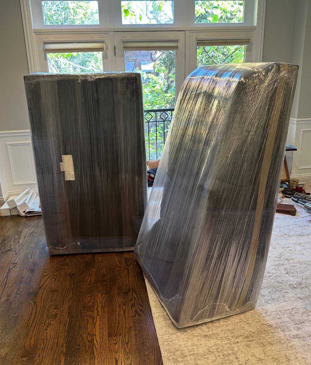 Two wrapped furniture pieces