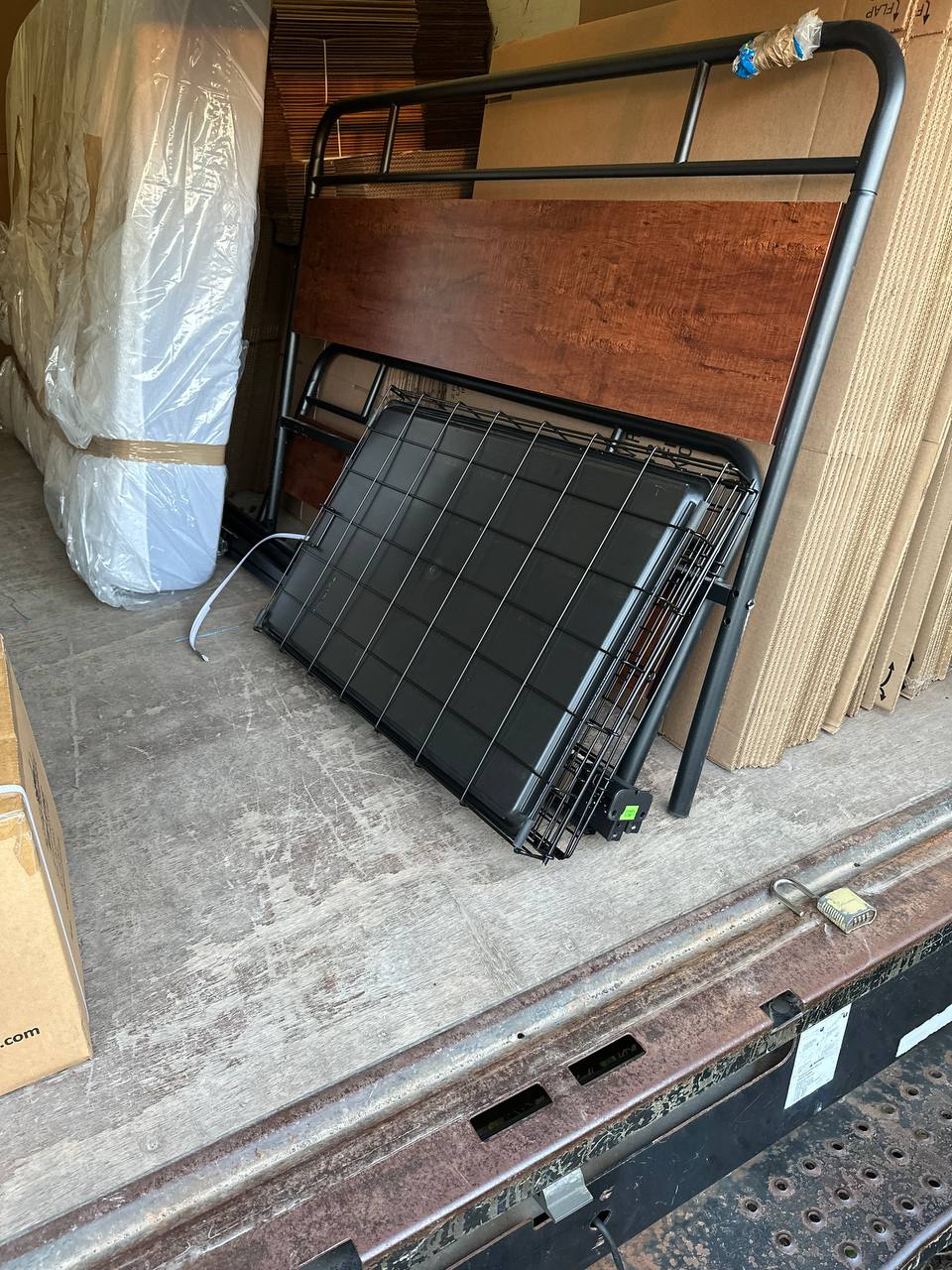 Bed frame and mattress in truck