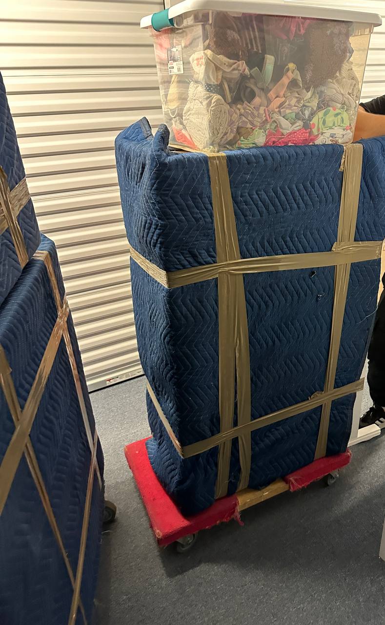 Wrapped furniture on dolly in storage