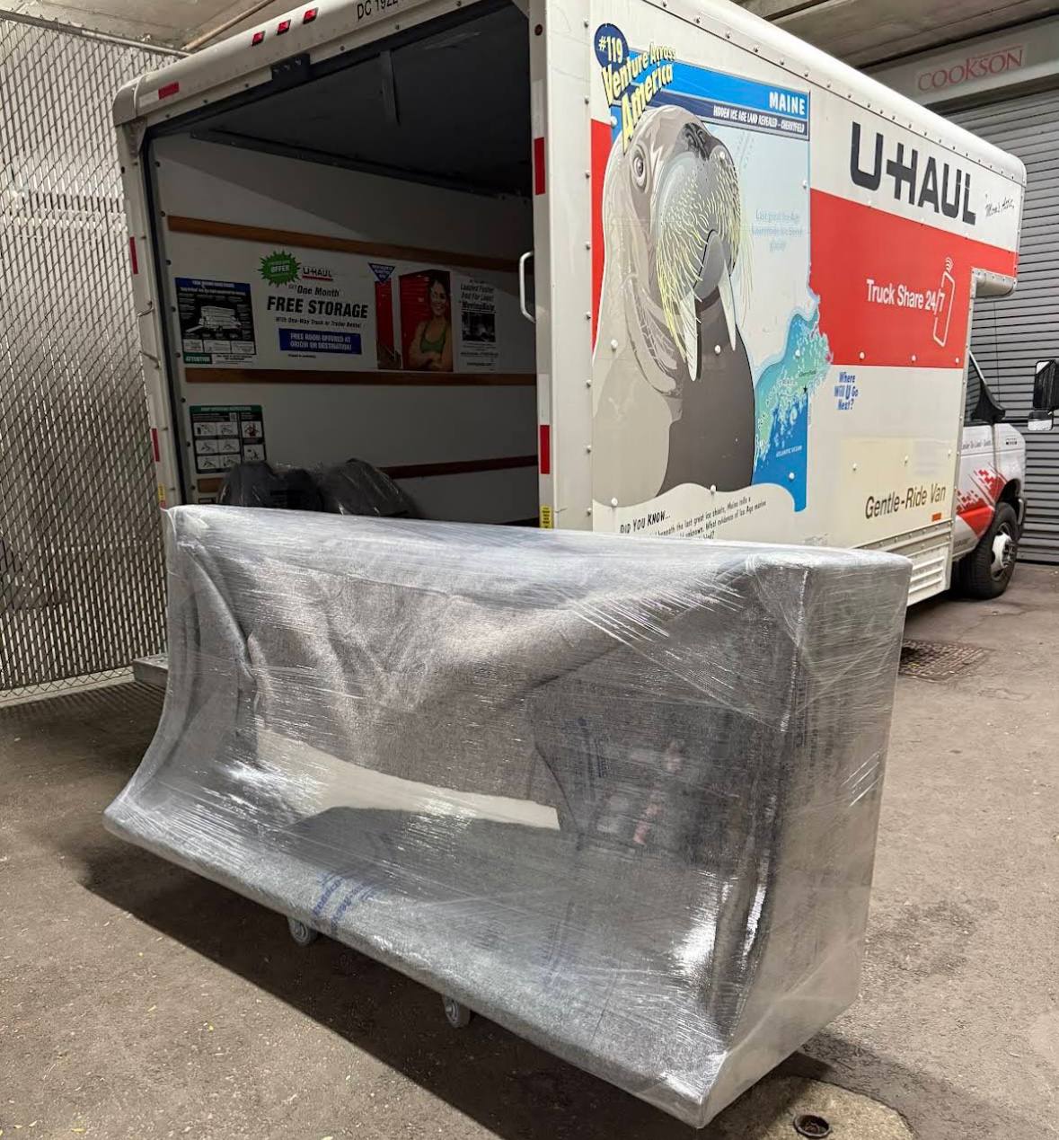 Wrapped sofa on dolly