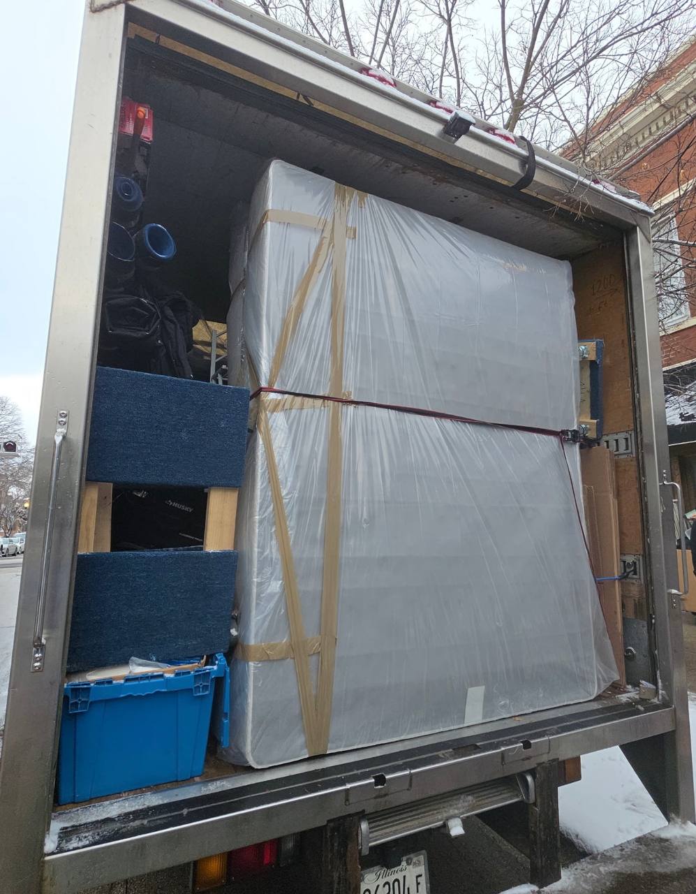 Large wrapped item in truck during winter