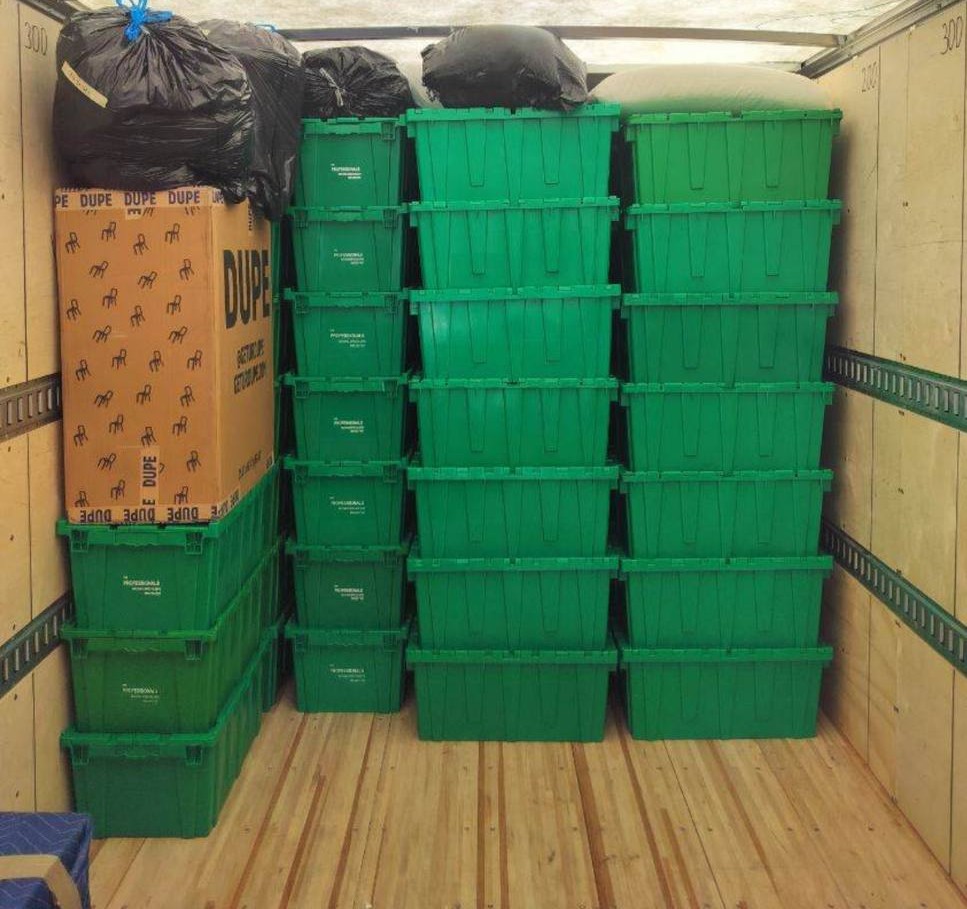 Green storage bins in truck