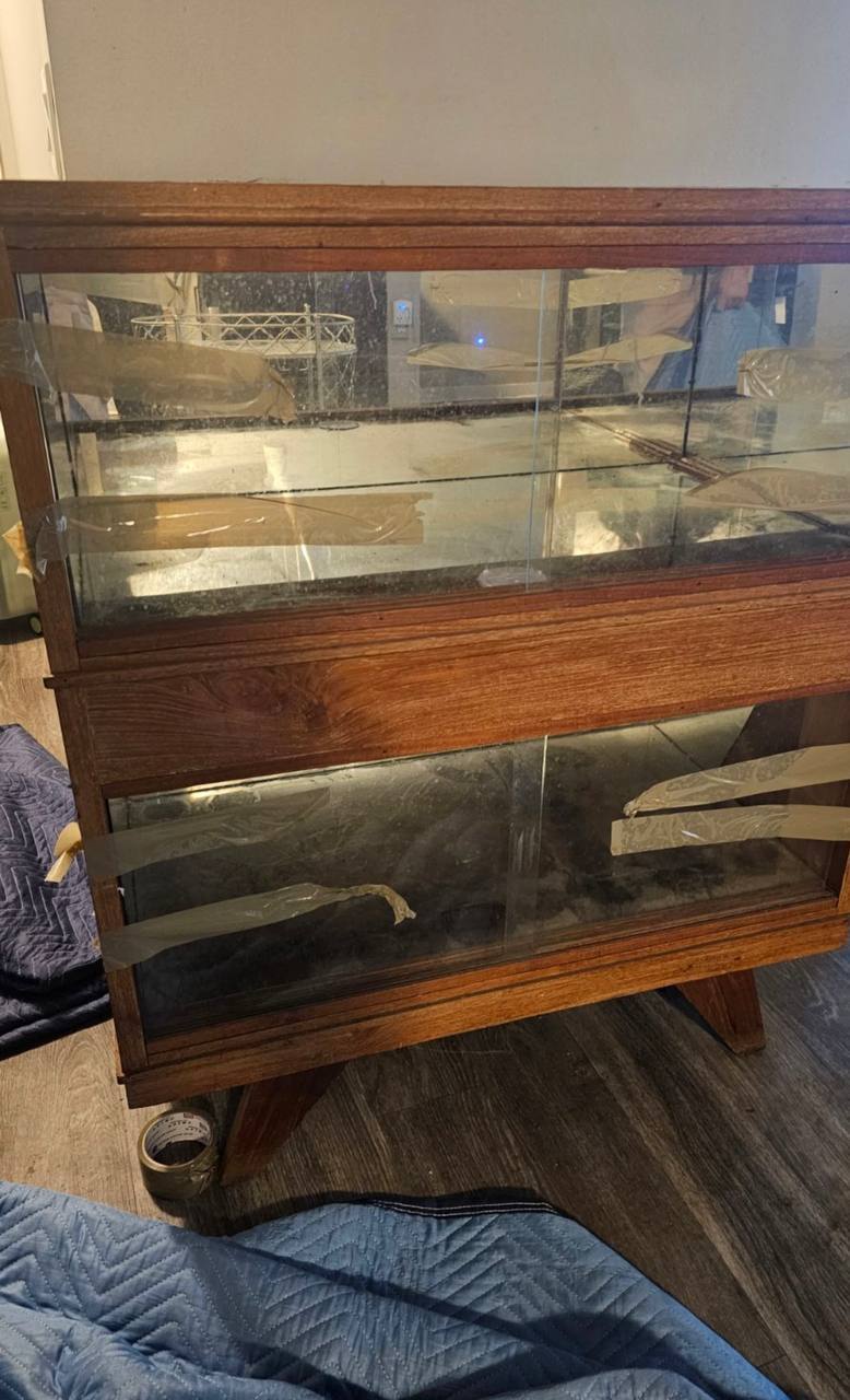Wooden display case with glass panels