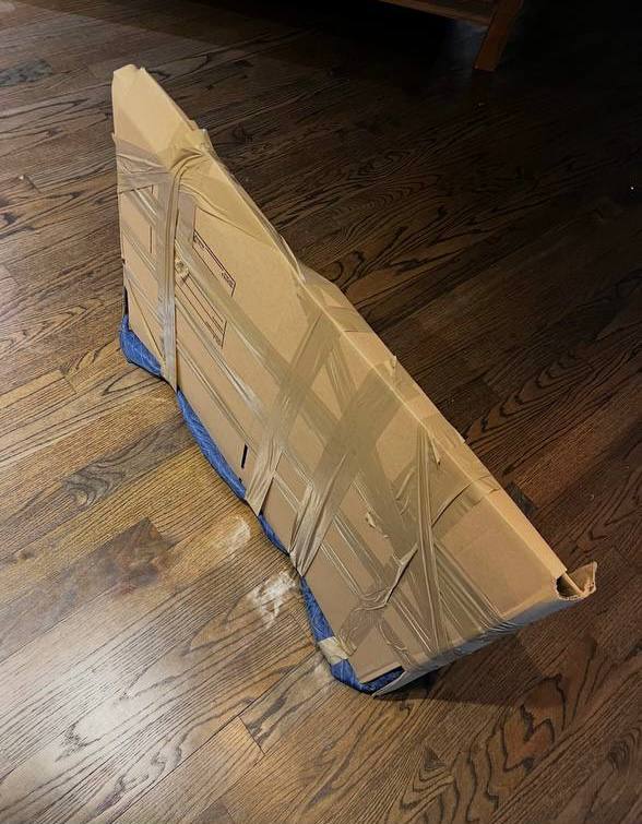 TV wrapped in cardboard