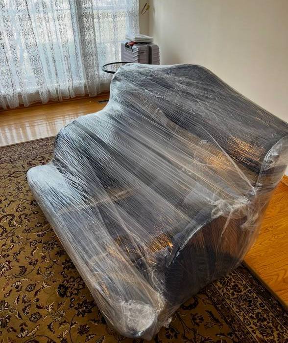 Wrapped piano for moving