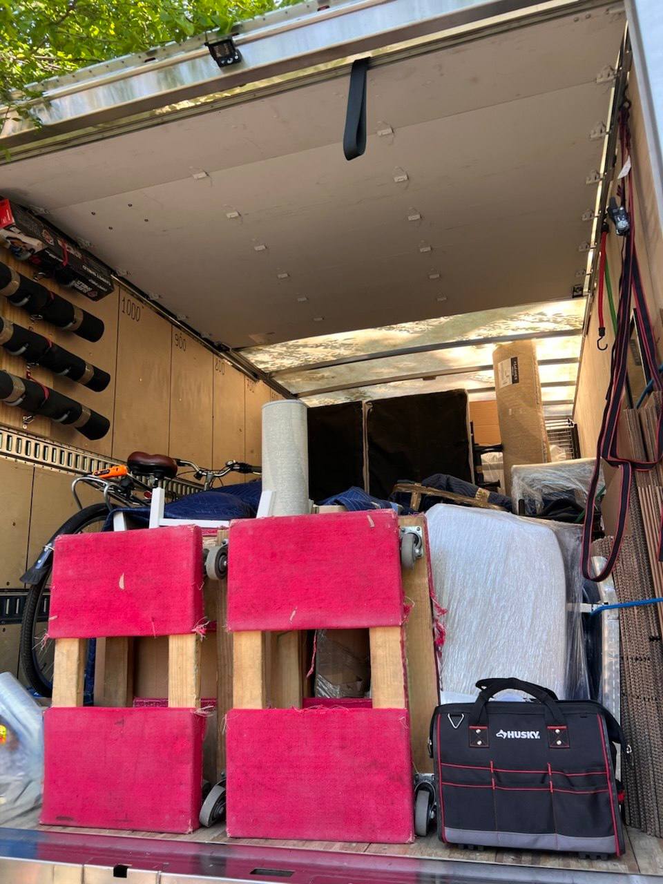 Moving truck with furniture and bicycle