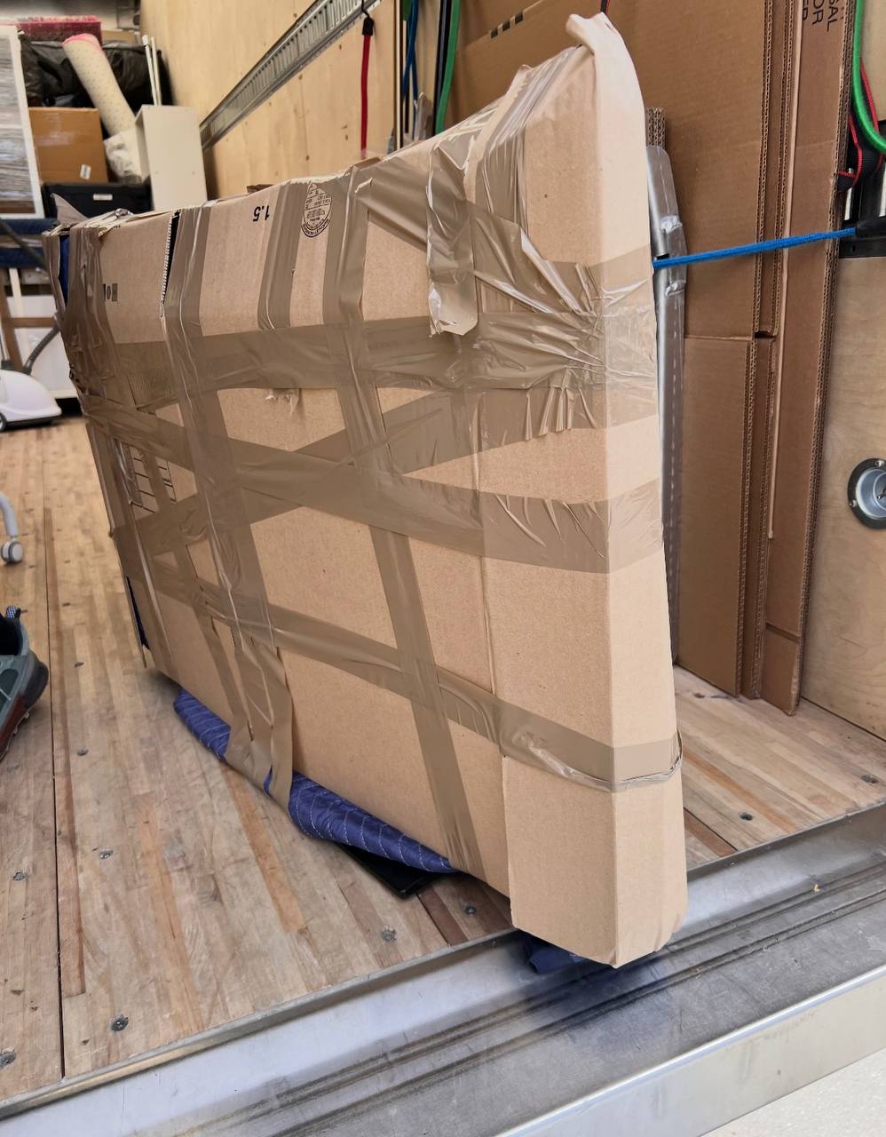 Large furniture wrapped in cardboard