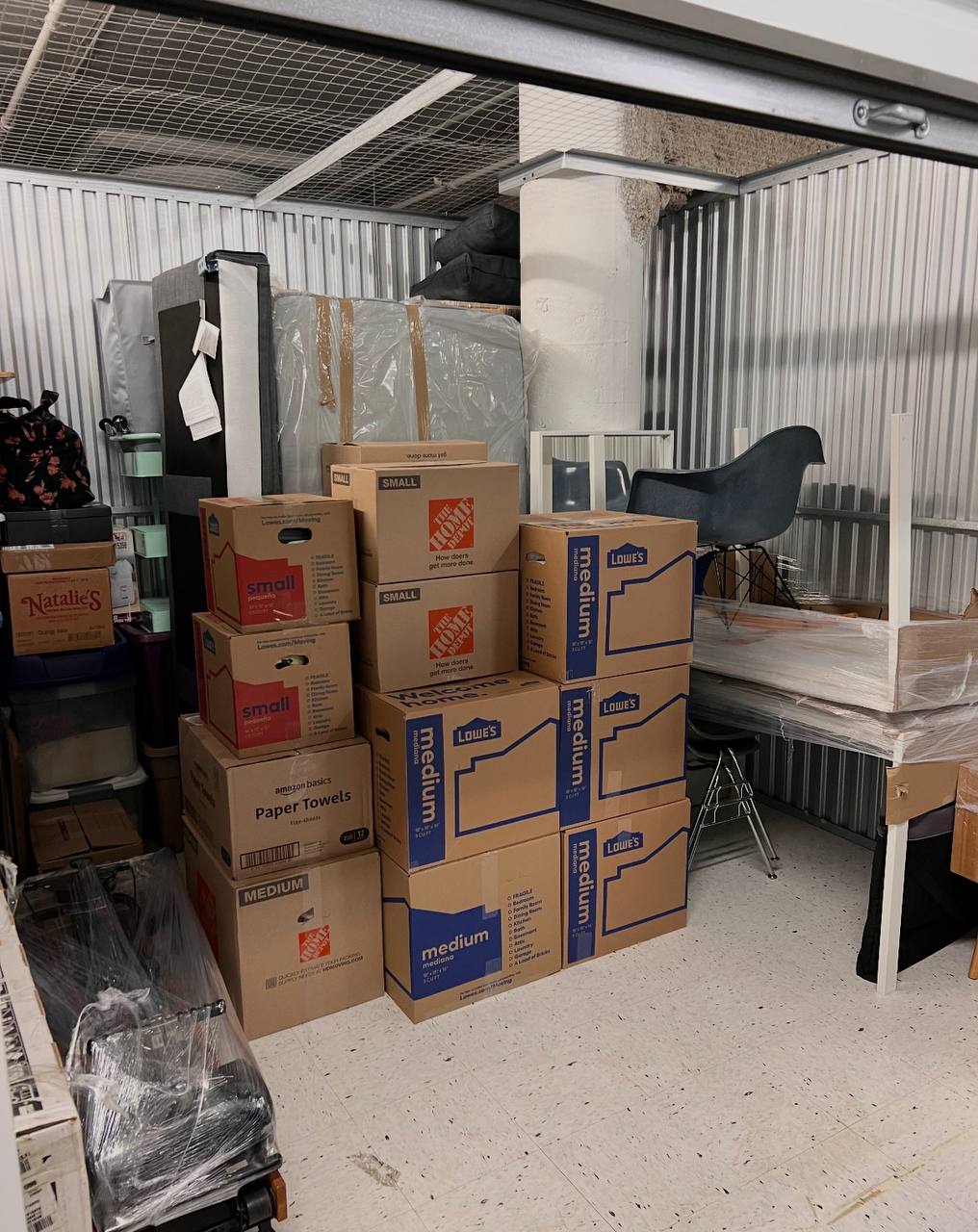 Storage unit with boxes and furniture