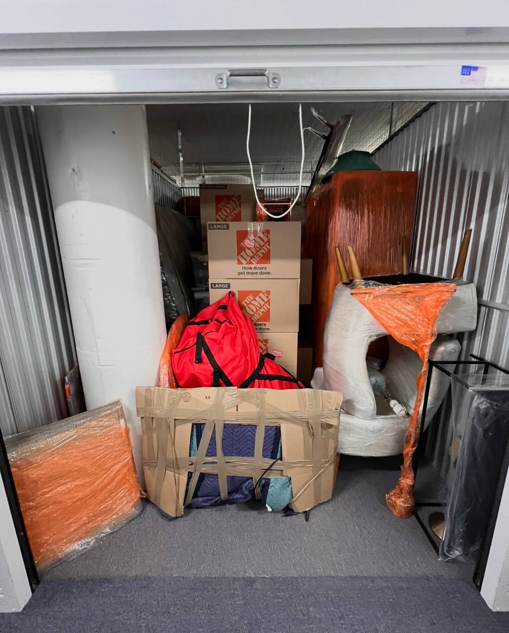 Storage unit with wrapped furniture