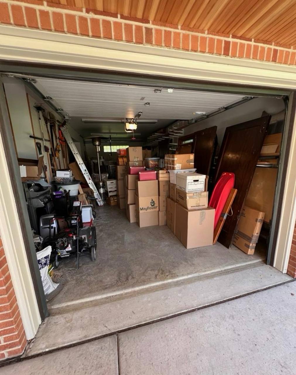 Packed garage with boxes and equipment