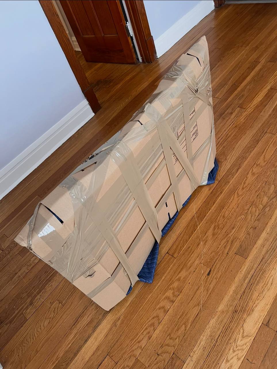 Large furniture wrapped in cardboard
